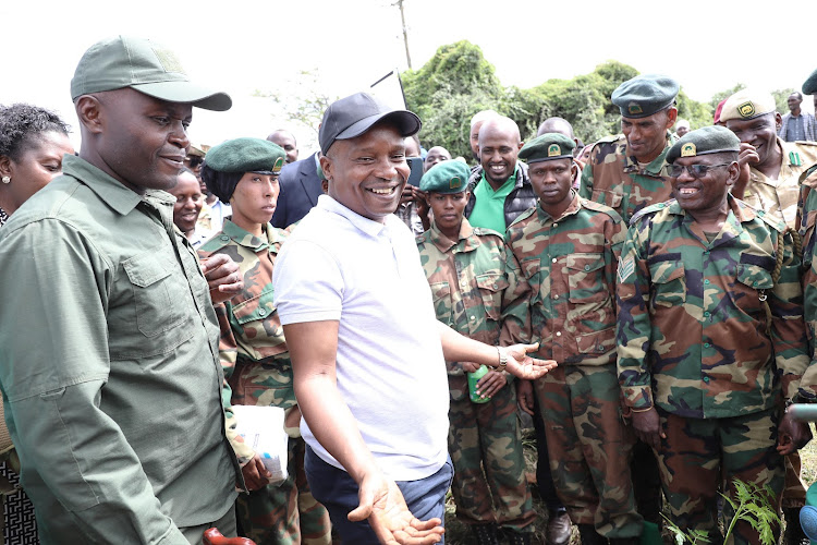 Interior CS Kithure Kindiki interacting with military officers during national tree planting day in Saku, Marsabit County on May 10, 2024.