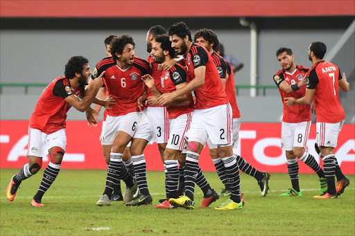 Egypt's forward Mohamed Salah (C) celebrates with teammates after scoring a goal during the 2017 Africa Cup of Nations group D football match between Egypt and Ghana in Port-Gentil on January 25, 2017.