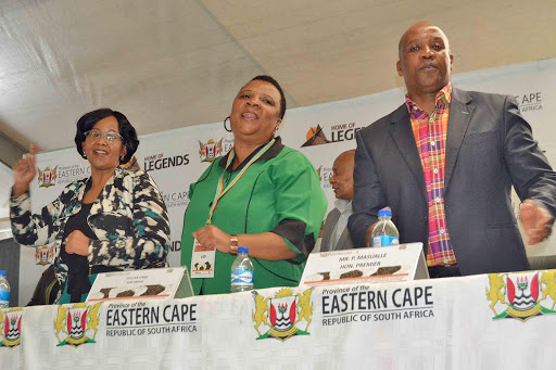 COME TOGETHER: From left, Deputy Tourism Minister Thoko Xasa, Elundini local municipality mayor Nonkongozelo Lengs and Premier Phumulo Masualle sing at the Freedom Day celebrations in Maclear Picture: LOYISO MPALANTSHANE