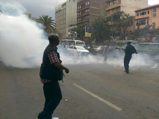 Police disperse protesters at Moi Avenue, Nairobi on Monday, December 12. /COURTESY