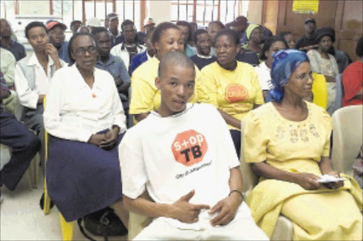 EASING THE DISEASE: Patients sitting at a TB clinic. Pic. Peter Mogaki. 10/03/2004. © Sowetan.