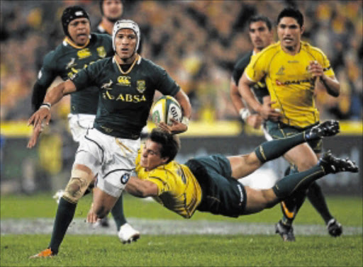 Springbok fullback Gio Aplon is tackled by Nick Phipps of Australia during the Tri-Nations rugby union match in Sydney on Saturday. Aplon has withdrawn from the Bok squad due to injuries Picture: TIM WIMBORNE/GALLO IMAGES