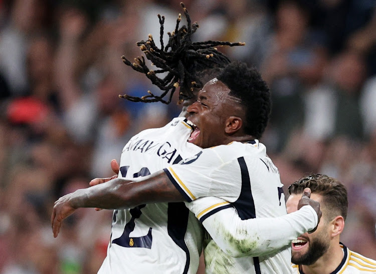 Real Madrid's Eduardo Camavinga and Vinicius Junior celebrate after winning their Champions League semifinal against Bayern Munich in the second leg at the Santiago Bernabeu in Madrid on Wednesday night.
