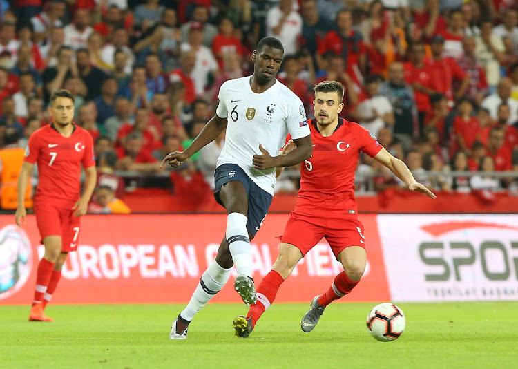 France's Paul Pogba in action with Turkey's Dorukhan Tokoz during a European qualifying match on June 8 2019.