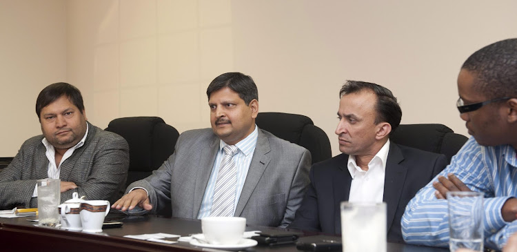 Indian businessmen, Ajay Gupta (L) and younger brother Atul Gupta, Oakbay (C) MD Jagdish Parekh (R) with Sahara director, Duduzane Zuma (Far Right). File photo