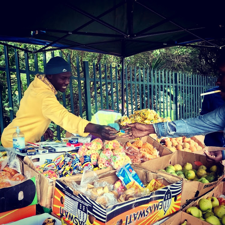 Some South Africans are buying up all the stock of street vendors to give them a boost before the lockdown. File picture.