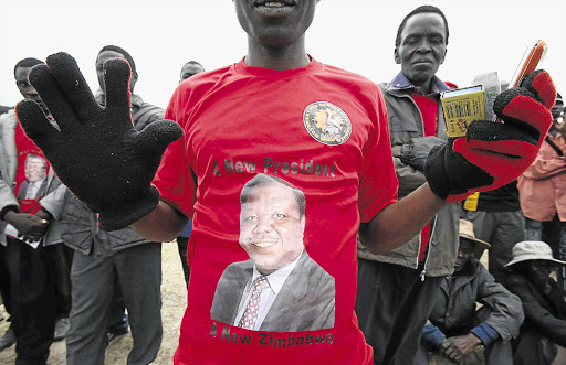 Supporters of MDC leader Morgan Tsvangirai - who would win the upcoming election if it were free and fair
