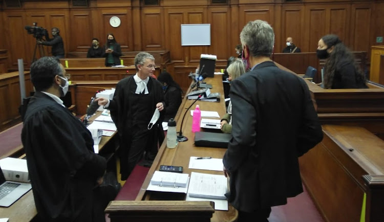 British American Tobacco SA lawyer Alfred Cockrell, centre, told the Cape Town high court that the billions of rand lost to the fiscus during the ban on the sale of tobacco products 'could have been used to combat the effects of the pandemic, for example by erecting field hospitals'.