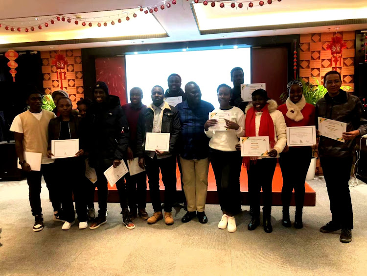 Education Attache Innocent Mogunde with Kenyan students in Shanghai on January 23, 2024