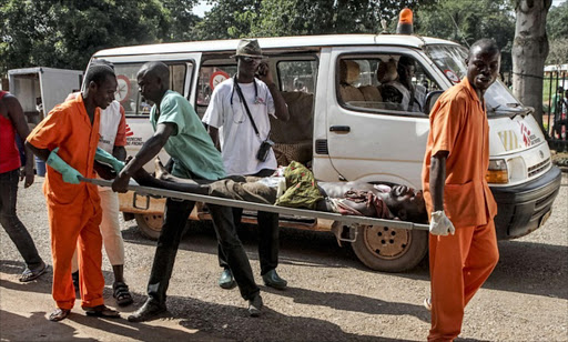 A wounded man is carried into the hospital in Bangui GETTY IMAGES