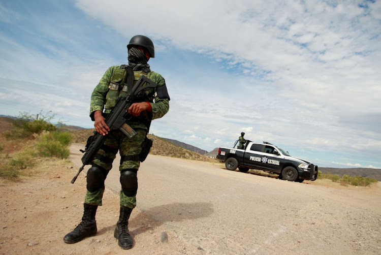 A soldier assigned to the National Guard is pictured at a checkpoint as part of an ongoing security operation by the federal government near the Mexican-American Mormon community of La Mora, Sonora state, Mexico, on November 6 2019.