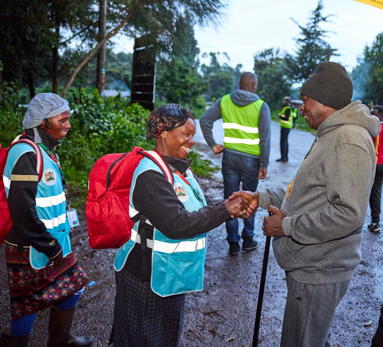 Deputy President Rigathi Gachagua interacts with Community Health Promoters he met in his village in Nyeri while on his usual morning walk on April 6, 2024