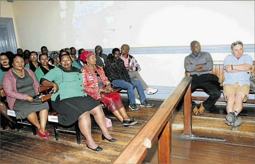 IN THE DOCK: Seated facing the camera are Siza Masentile and Karl Krull, both accused of attempted murder, assault and crime injuria. Against the wall to the left are Lwando Folokwe and Akhona Dyantyi, accused of illegal hunting, at the Komga Magistrate’s Court yesterday Picture: MICHAEL PINYANA