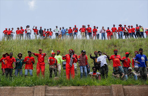 EFF members gather outside the Constitutional Court this week during the hearing into the public protector’s report on Nkandla. In a shock development, President Jacob Zuma’s advocate conceded that her recommendations are binding.