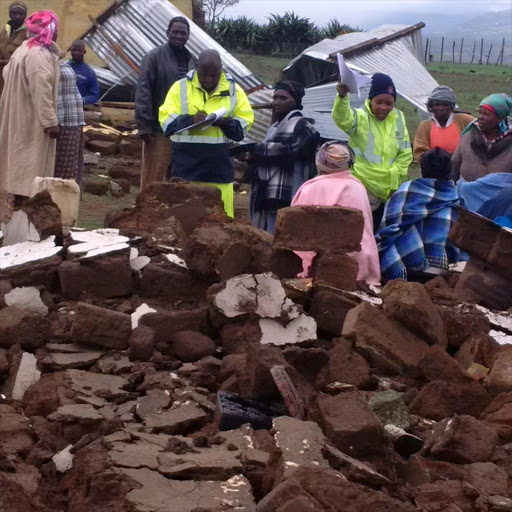 TRAIL OF DESTRUCTION: Disaster management officials from Alfred Nzo district talking to some of the villagers affected by the storm in Mount Frere. Picture: SUPPLIED