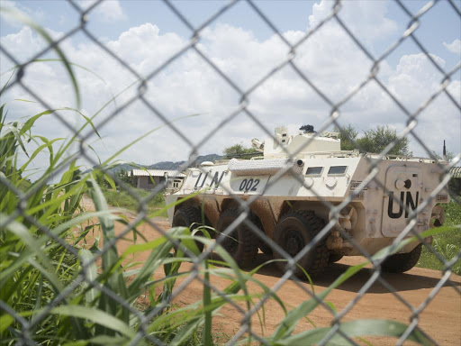 A United Nations peacekeepers ride in their armored personnel carrier (APC) as they patrol the perimeter of the protection of civilians site hosting about 30,000 people displaced during the recent fighting in Juba, South Sudan, July 22, 2016 /REUTERS