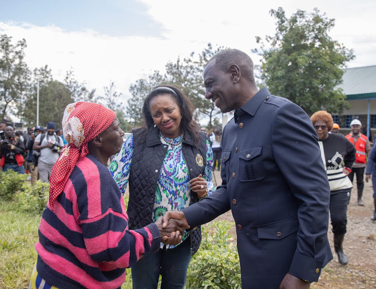 President William Ruto interacts with residents in Mai Mahiu landslide victims on April 30, 2024.