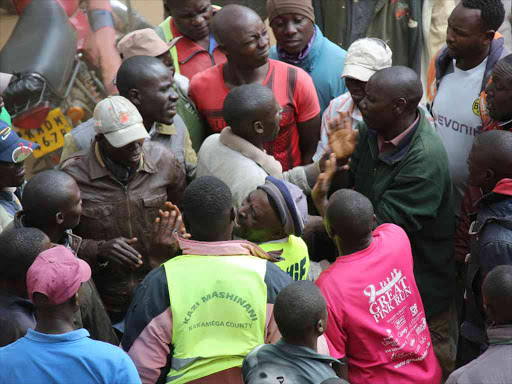 Boda boda operators scramble for cash given out by Kakamega governor aspirant Marble Muruli on Monday /HILTON OTENYO
