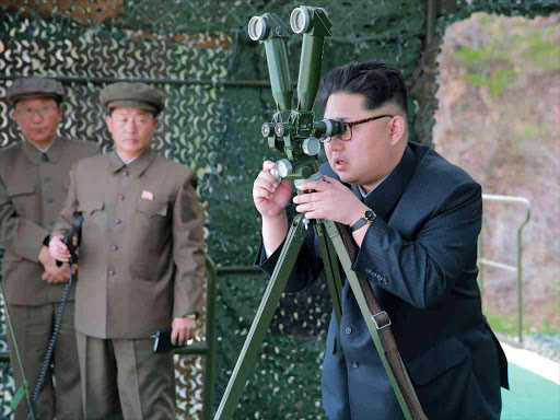 North Korean leader Kim Jong Un guides on the spot the underwater test-fire of strategic submarine ballistic missile in this undated photo released by North Korea's Korean Central News Agency (KCNA) in Pyongyang on April 24, 2016. Photo/REUTERS