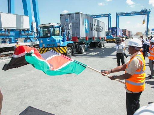 President Uhuru Kenyatta flags off a loaded container during the Launch of the Upgraded Inland Container Depot (ICD) Embakasi, Nairobi County, December 16. /PSCU