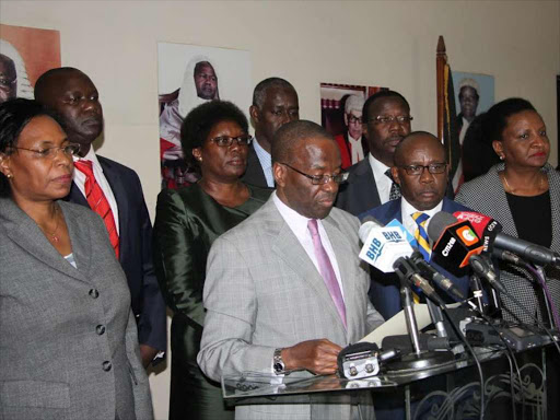 ON THE SPOT: CJ Willy Mutunga (C) and other JSC members address the press at Supreme Court buildings over bribery allegations against Justice Philip Tunoi on January 27.