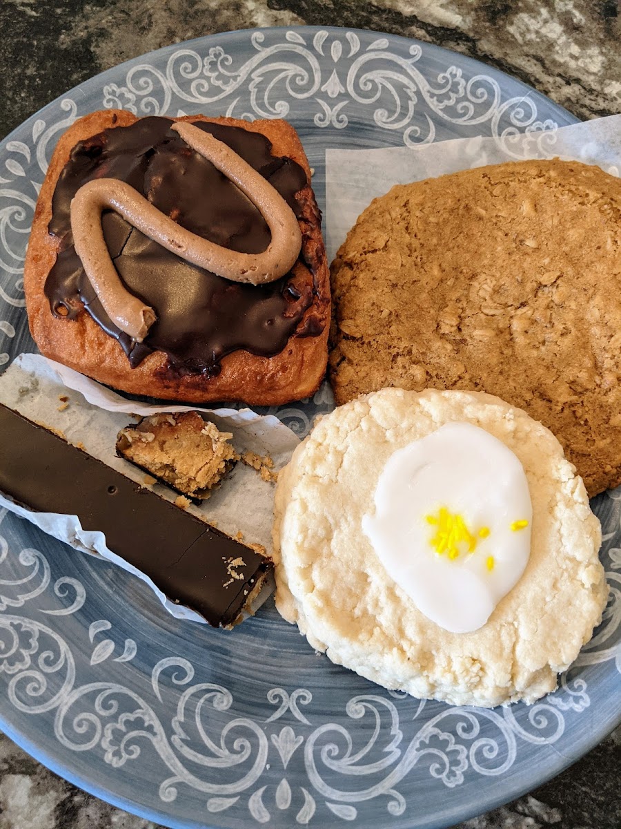 Chocolate peanut butter cream filled square donut, lemon shortbread cookie, chewy oat cookie and "Twix" bar.
