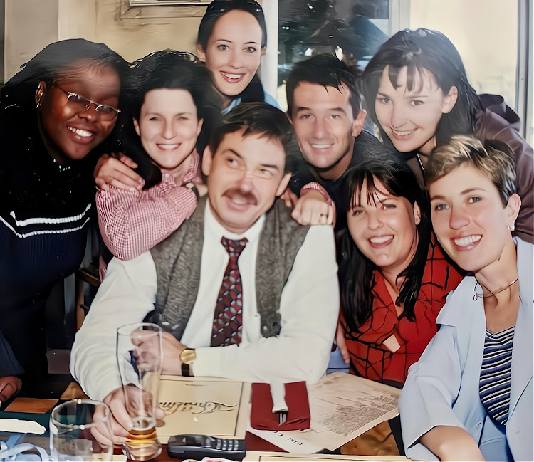 Editor Jeremy McCabe, centre, with his Weekend Post news team from the early 2000s, back from left, journalist Nosipho Kota, news editor Traci Mackie, reporter Recah Theodosiou, subeditor Hagen Engler and photographer Donna Watson. Next to McCabe are reporters Samantha Smith and Kathy Sundstrom, far right. Kota died in 2019