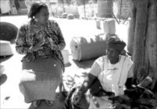 TRAUMATISED: Blouberg municipal mayor Refilwe Kubyana talks to Raesibe Mashalane, mother of murdered Sarah Mashalane. Pic. Edward Maahlamela. © Sowetan.