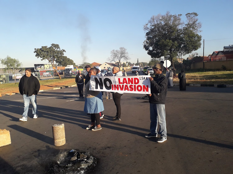 Residents from Lenasia South during a previous protest against an alleged land invasion in the area.