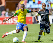 Mamelodi Sundowns captain Hlompho Kekana (L) and his Orlando Pirates counterpart Oupa Manyisa. 