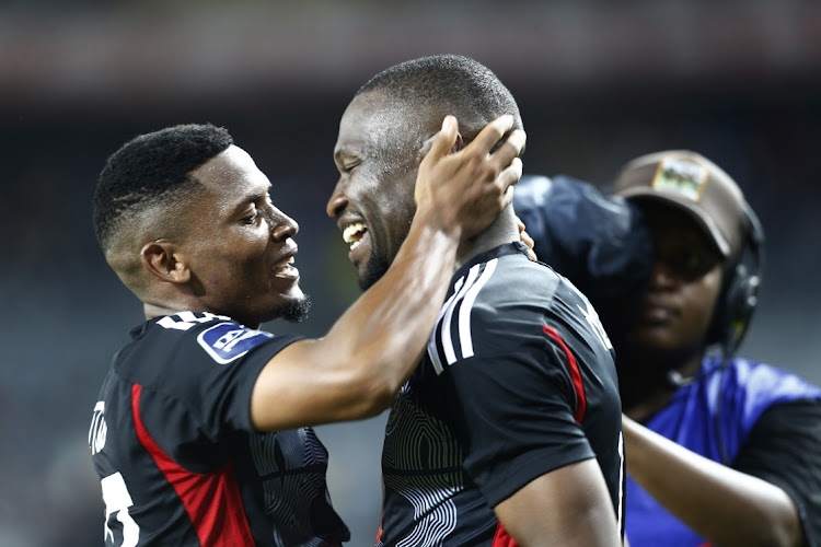 Tshegofatso Mabasa (right) celebrates one of his his goals with Orlando Pirates teammate Thabiso Lebitso in the DStv Premiership match at Orlando Stadium on Saturday.