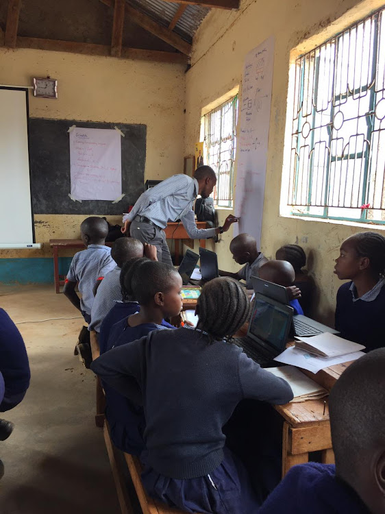 STEM educator Stephen Mwanduka facilitates a coding class at Kinakoni Primary School in Mutomo, Kitui county