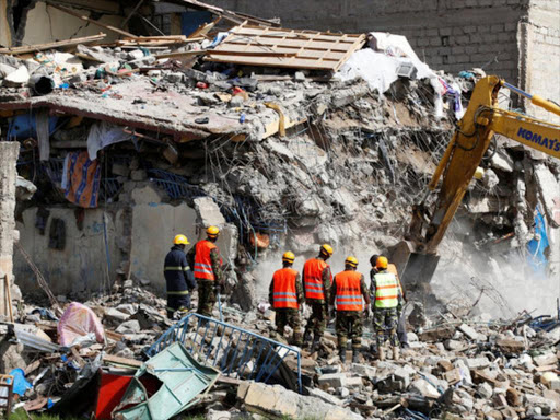 Emergency personnel work at the scene after a building collapsed in a residential area of Nairobi, Kenya June 13, 2017. REUTERS