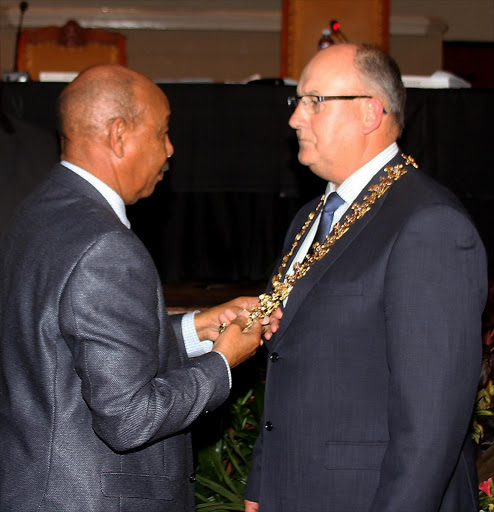 FILE PICTURE: Speaker Jonathan Lawack places the mayoral chain around Athol Trollip’s neck to symbolise his election as mayor.