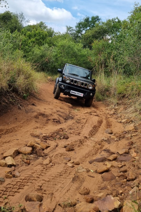 Falkiner picks his way through the riverbed.