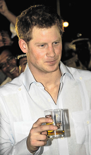 Prince Harry makes an appearance after nude photos of him were published Picture: GETTY IMAGES. File photo
