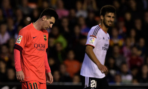 Barcelona's Argentinian forward Lionel Messi reacts during the Spanish league football match Valencia CF vs FC Barcelona at the Mestalla stadium in Valencia on November 30, 2014. Lionel Messi took to Instagram on Monday 8 December 2014 to complain about a doping test after Barcelona's match with Espanyol. JOSE JORDAN / AFP
