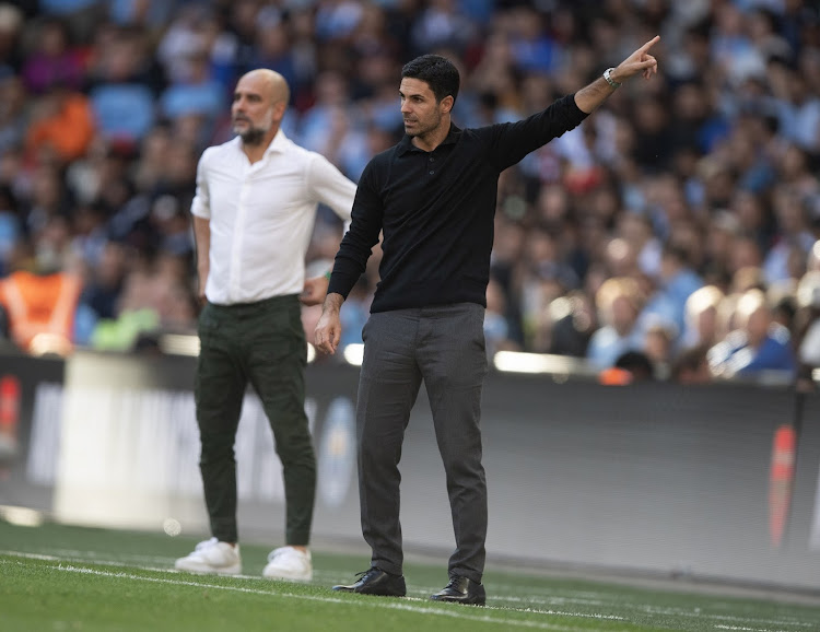 Arsenal manager Mikel Arteta (right) wants his team to enjoy the moment in Sunday's Premier League clash against a Manchester City coached by Pep Guardiola.