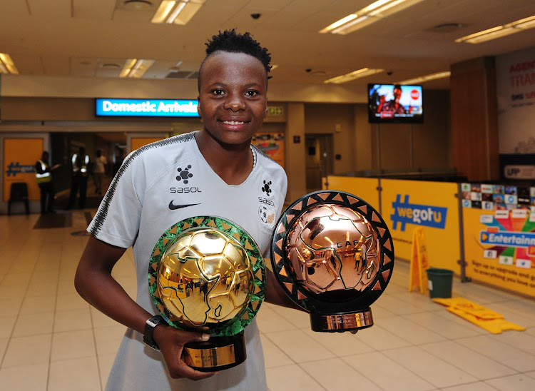 Banyana Banyana striker Thembi Kgatlana poses with her awards at the OR Tambo Airport on her return from Dakar in Senegal where she won the CAF African Women's Player of the Year as well as the African Goal of the Year on January 10 2019.
