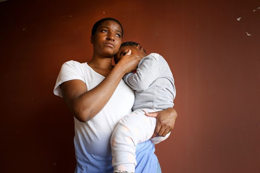 OCTOBER 8, 2017. Thandi Chaparadza (28), and daughter, Lara Munamathi, pose for a portrait near Cosmo City. Chaparadza was manhandled by security gaurds at a Grocery Store in front of her daughter. She laid laid charges at the police station and the security gaurds have been suspended. PHOTOGRAPH: ALON SKUY/THE TIMES