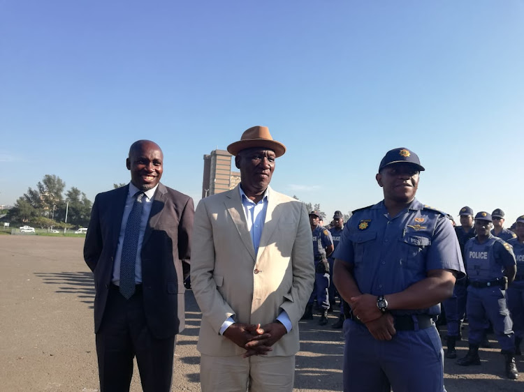 Transport, community safety and liaison MEC Mxolisi Kaunda, police minister Bheki Cele and Lt-Gen Nhlanhla 'Lucky' Mkhwanazi at a police parade in Durban on Friday where Cele advised police to keep cool heads ahead of the elections on May 8.