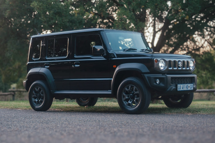 Our Suzuki Jimny 1.5 GLX MT five-door is licked a menacing shade of 'Bluish Pearl Black,' which should prove a challenge to keep clean.