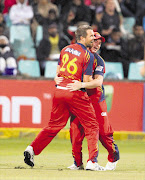 Dirk Nannes and Ross Taylor celebrate the Highveld Lions' win over the Delhi Daredevils Picture: ANESH DEBIKY/GALLO IMAGES