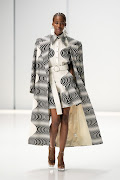 Model walking in a monochromatic tribal print look during The Bam Collective SA Fashion Week Spring Summer 2024 runway.