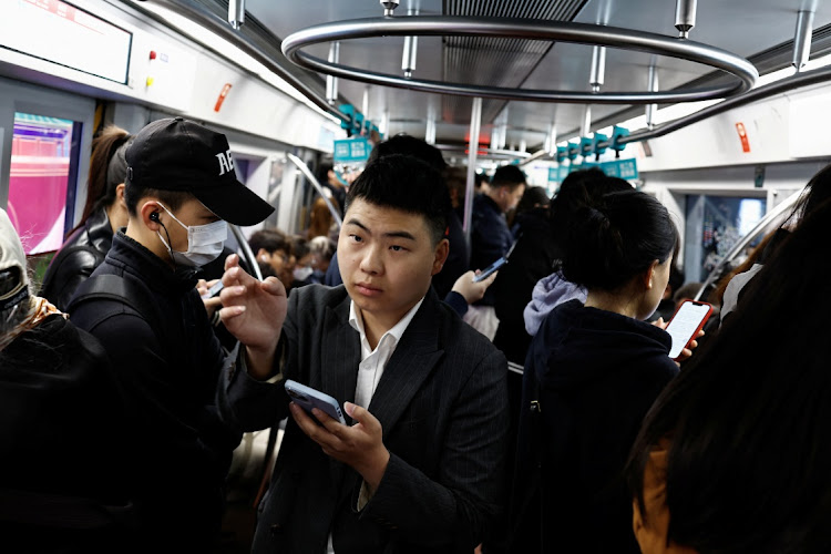 People ride a subway train during morning rush hour in Beijing, China, April 11 2024. Picture: REUTERS/Tingshu Wang