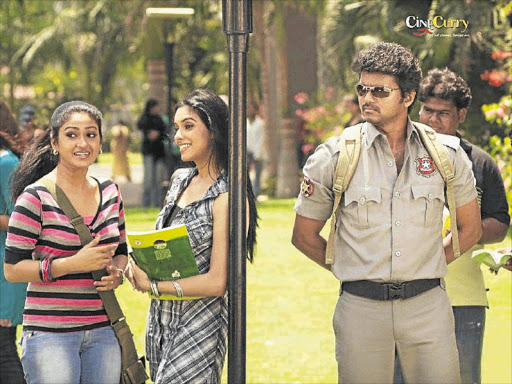 KEEPING AN EYE: Mithra Kurian, Asin and Vijay star in Kaavalan, one of 2011's big hits and which boosted Vijay's failing career