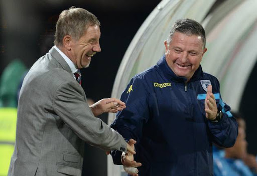 Stuart Baxter and Gavin Hunt share some light moment during the Absa Premiership match at Lucas Moripe Stadium on April 26, 2016 in Pretoria, South Africa.