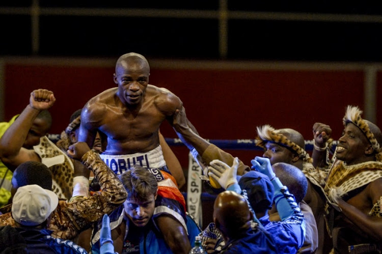 Moruti Mthalane hoisted high as he wins by TKO against Genesis Libranza during the Boxing from Wembley Arena on April 28, 2017 in Johannesburg, South Africa.