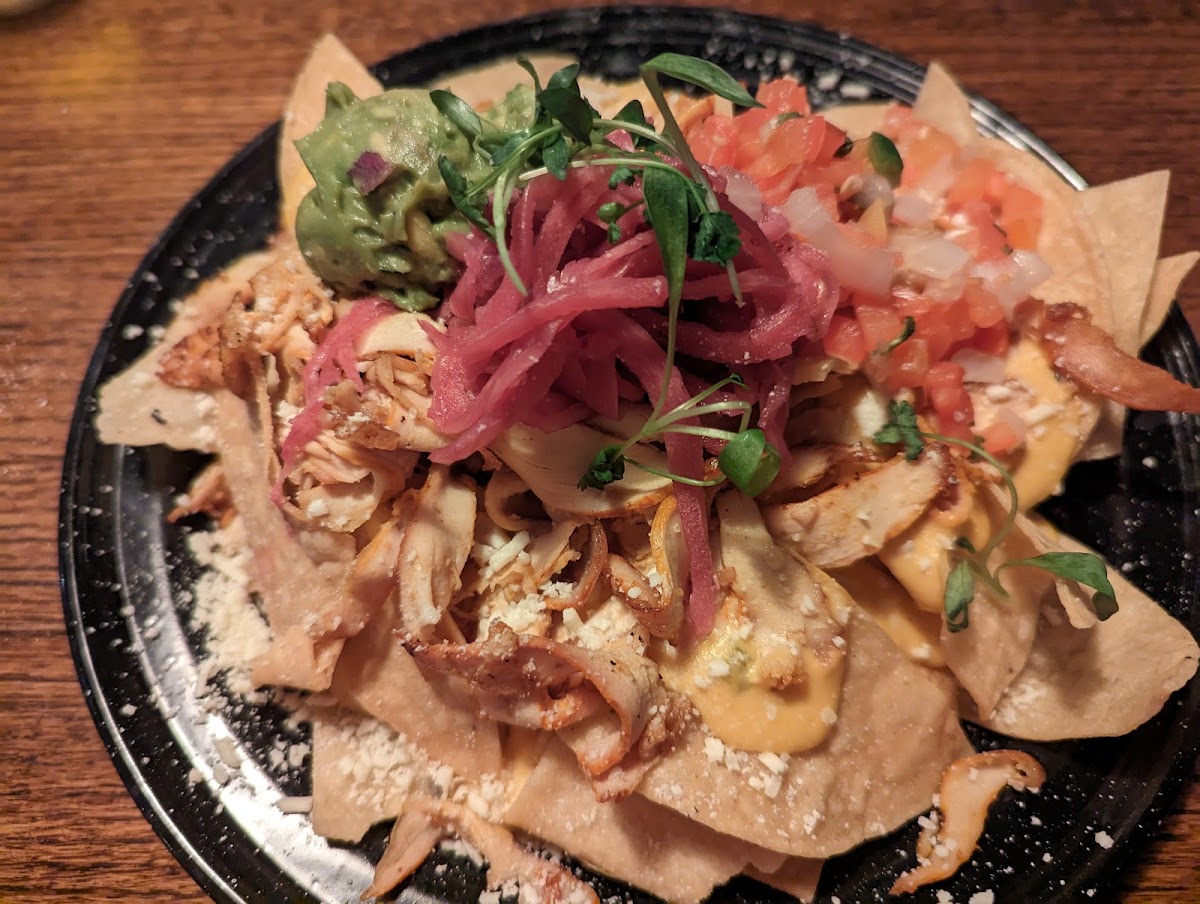 Nachos, hold the jalapenos and sour cream, add the chicken.