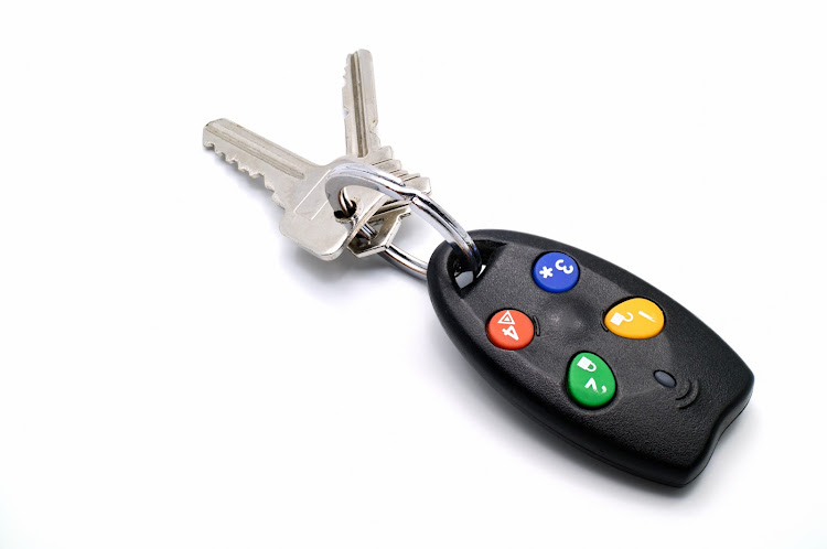 One of the suspects triggered a panic alarm when he pressed a button on a remote with the house keys. Stock photo.